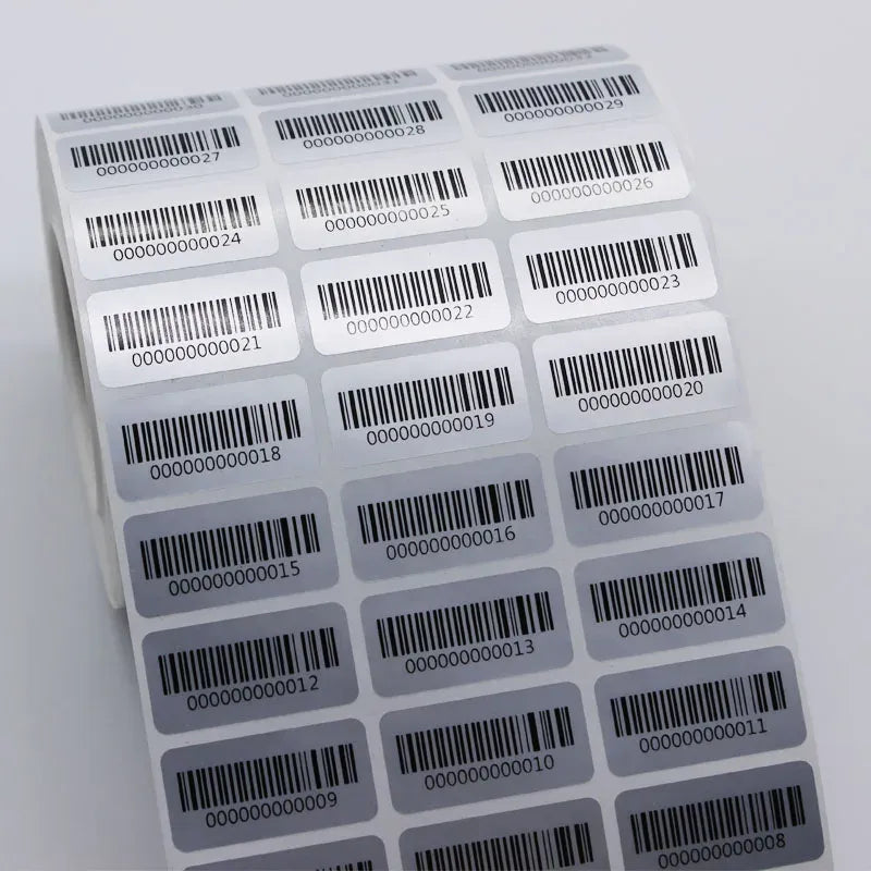 Barcode number label sheet with black barcodes and digits on white sticker backing.