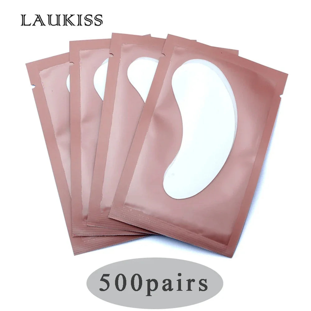 Laukiss gel under-eye lash extension patches in metallic pink sachets for professional eyelash beauty application.