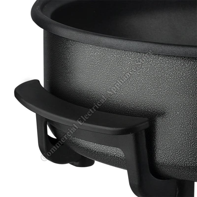 Electric non-stick hot pot side handle and textured black housing detail.