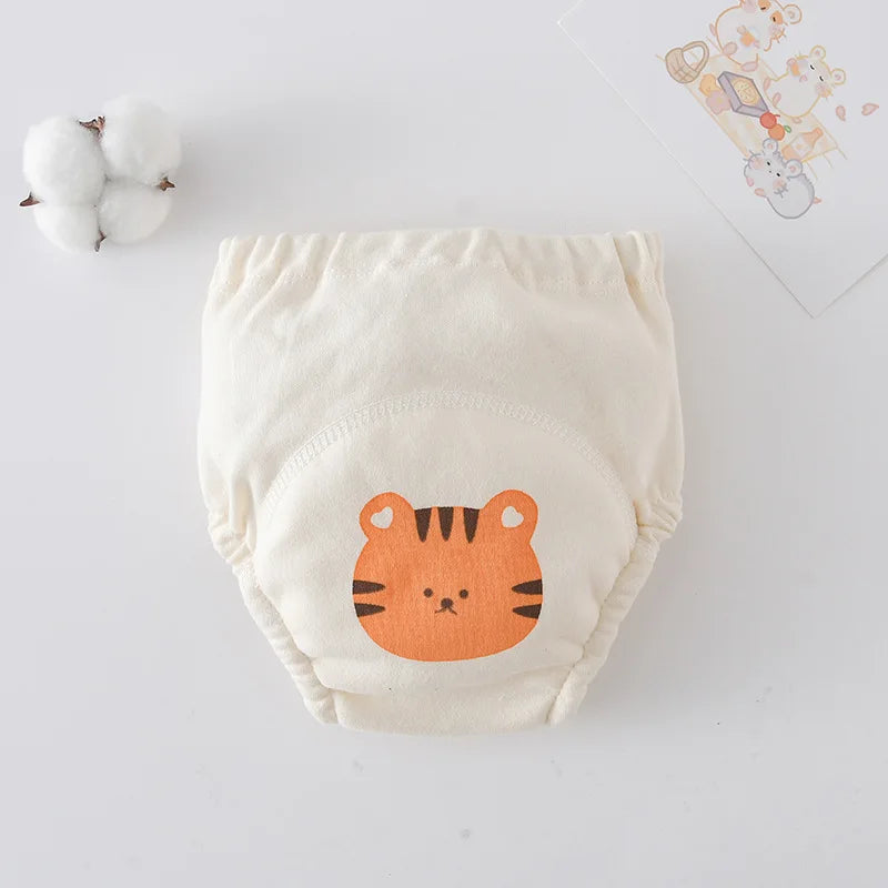 Baby care cloth training diaper with cute tiger print, soft organic cotton design.