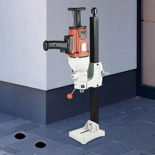 Compact core drilling rig with electric motor and base stand, ready for wall drilling