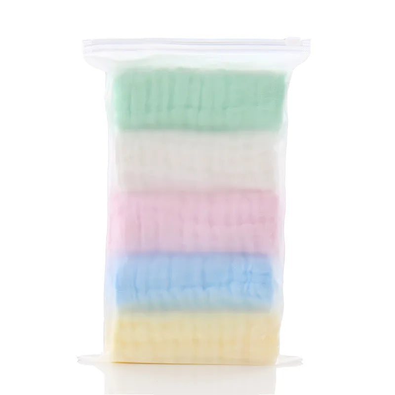 Pack of 5 colorful muslin baby washcloths for gentle skincare in a clear storage bag.