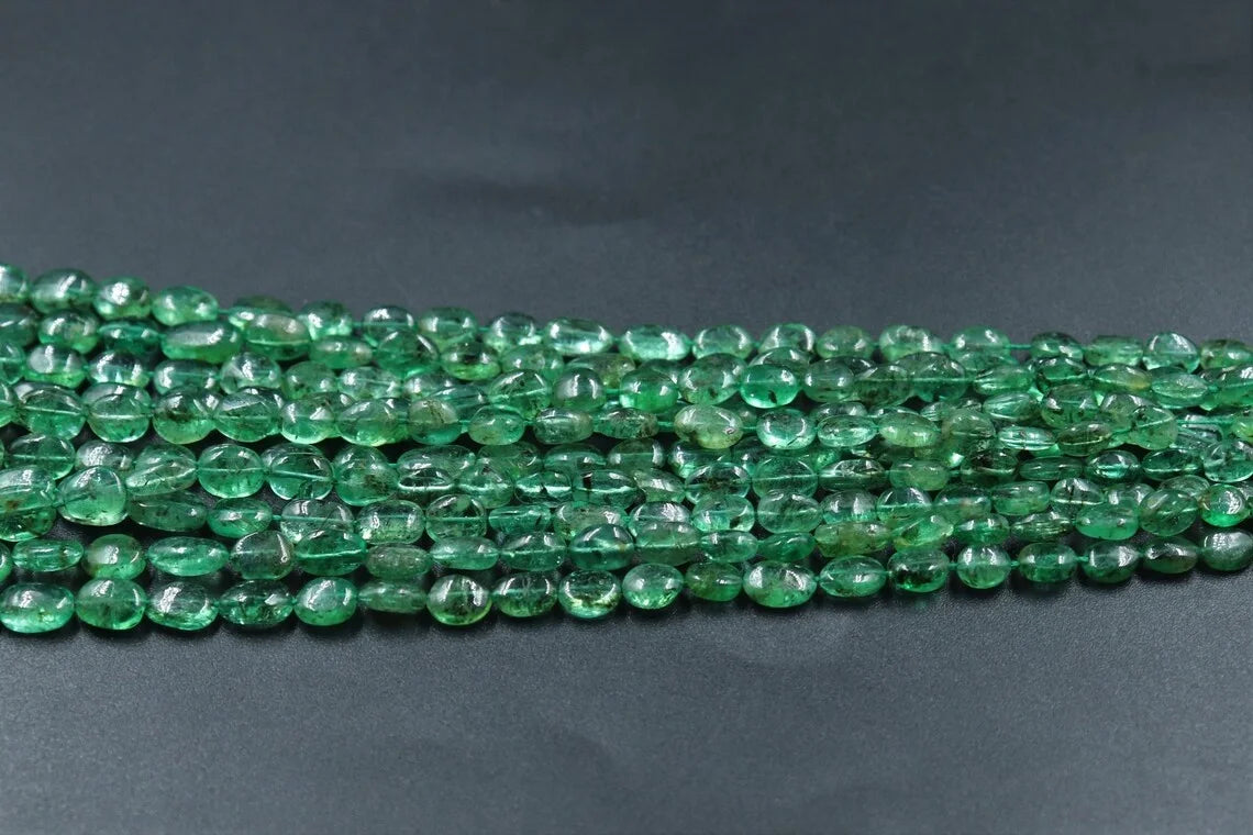 Straight strand of smooth green oval beads, glossy finish for jewelry