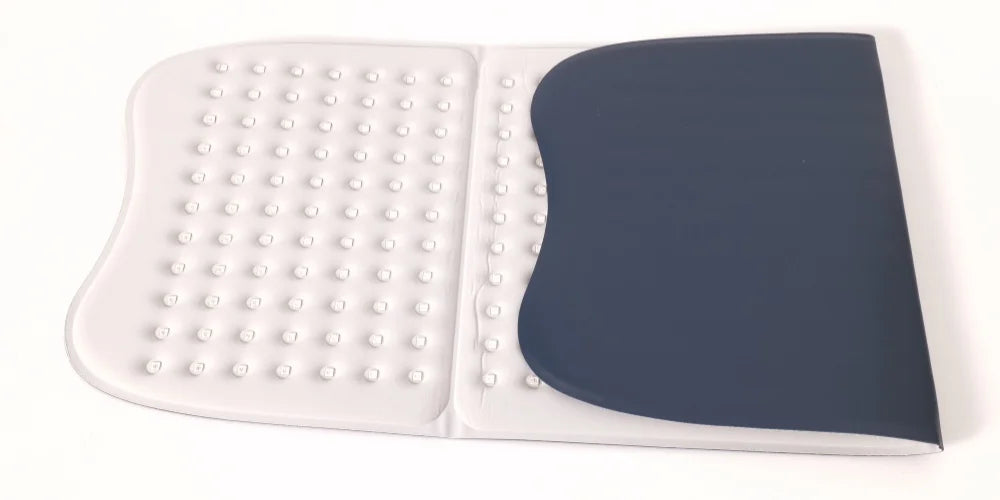 Large, rectangular light therapy mat, half-white with small LED nodes, half-dark blue, on a white background.