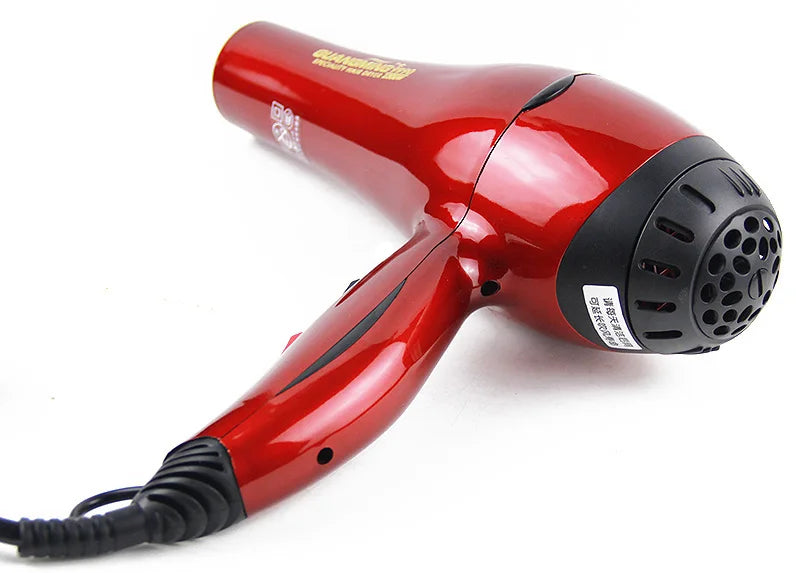 Professional 2300W red salon hair dryer with long cord, ergonomic design, and black rear intake grill.