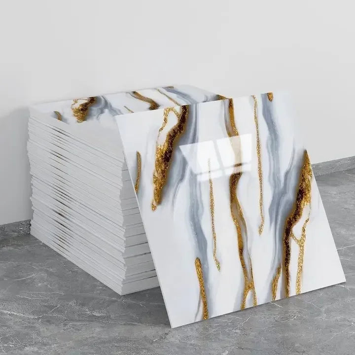 Marble peel-and-stick backsplash wall panel sheets in white with gold drip-like veins