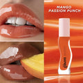 Gisou Honey Infused Lip Oil in Mango Passion Punch: a high-shine, plumping orange lip gloss for hydrated, glossy lips.