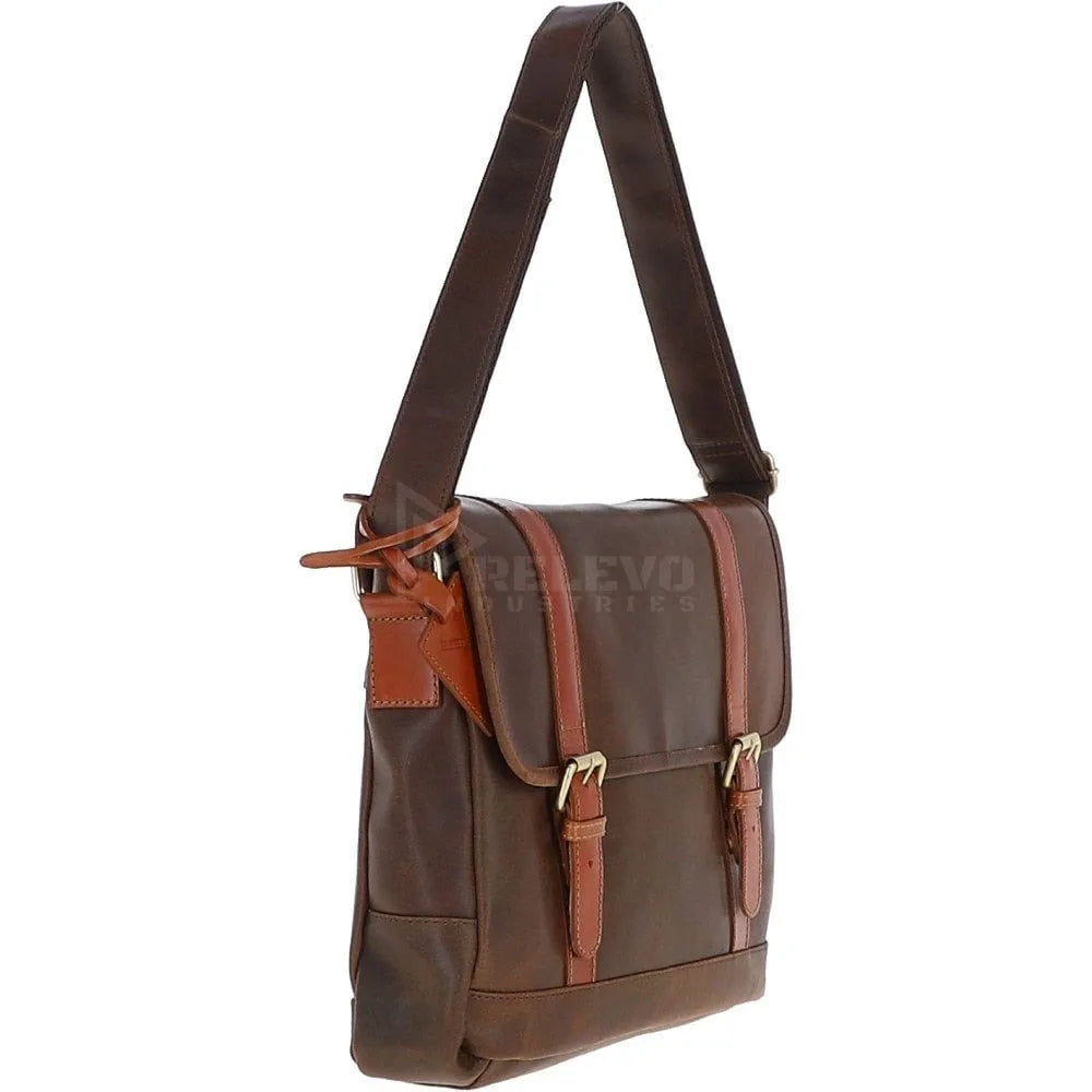 Minimalist brown leather messenger bag with buckle straps, adjustable shoulder strap, and luxury travel aesthetic.