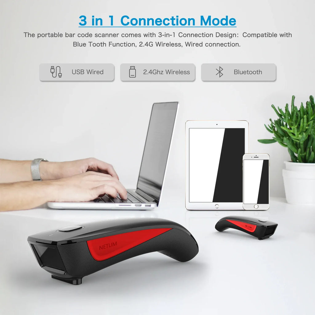 Handheld 2D barcode scanner with red accent held near a laptop