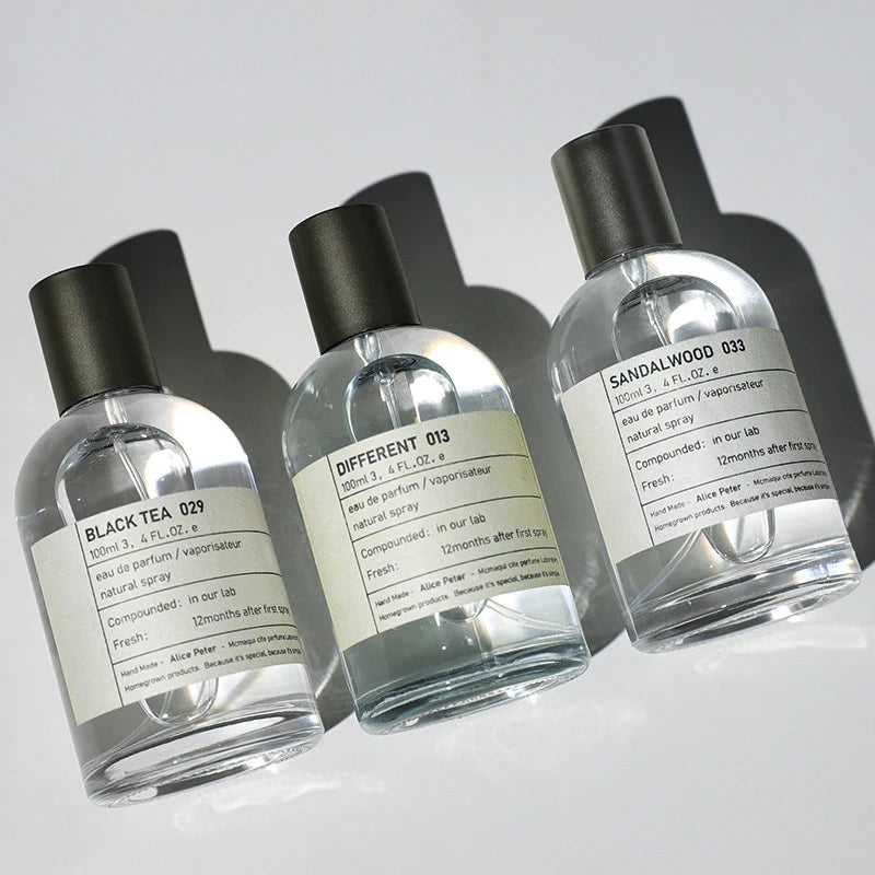 Alice Peter unisex 100ml EDT perfume set. Sandalwood, Black Tea & fruity fresh scents in modern round glass bottles.