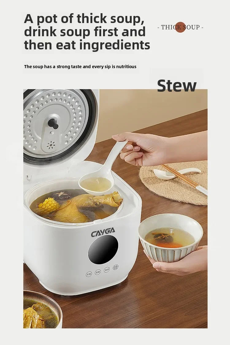 White mini electric rice cooker with open lid and soup inside ceramic inner pot