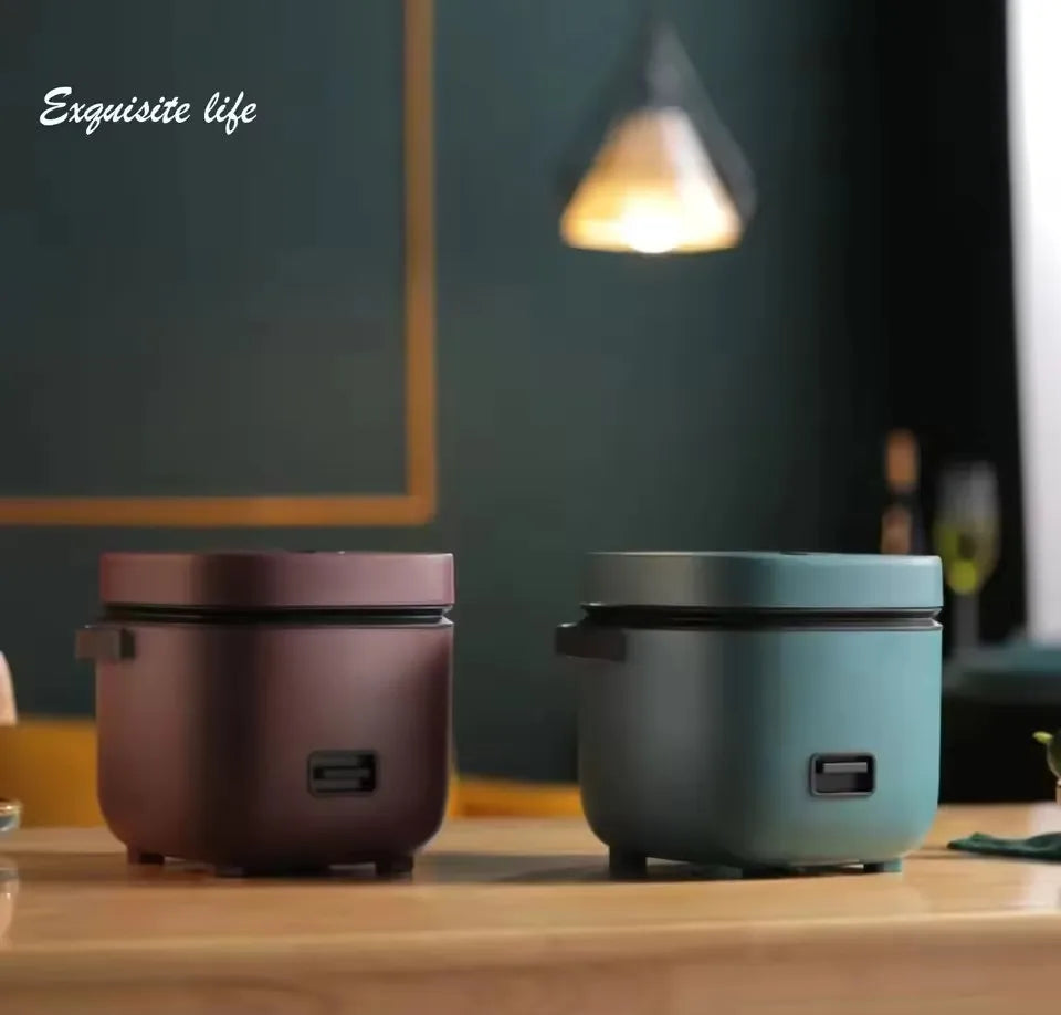 Mini electric rice cookers, two teal and brown units with black lid rims
