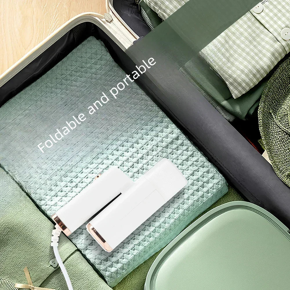 Tidesmit 1000W handheld garment steamer showing the 130ml water tank and compact steam nozzle design for travel.