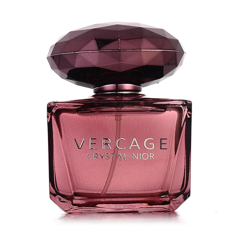 Luxury floral fragrance for women in a deep purple, diamond-faceted glass bottle with matching jewel-cut cap.