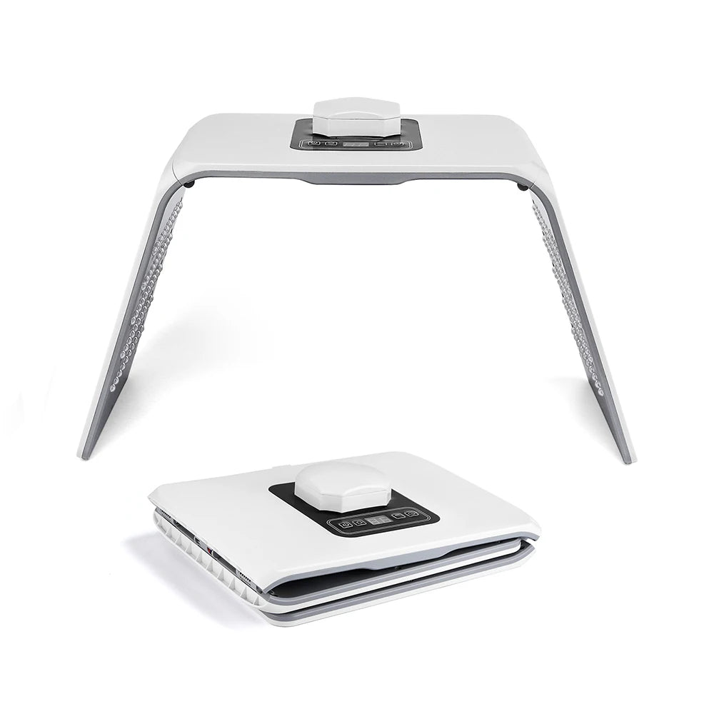 LED light therapy panel in open and folded positions. White plastic, arch-shaped device with internal light arrays.