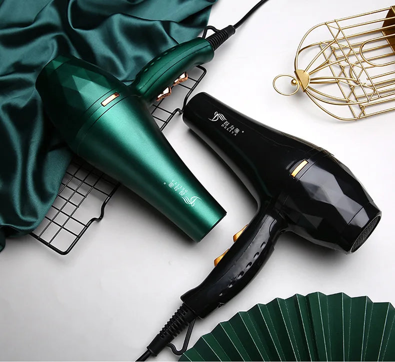 High-power green and black hair dryers with faceted design, featuring hot/cold settings for professional salon styling.