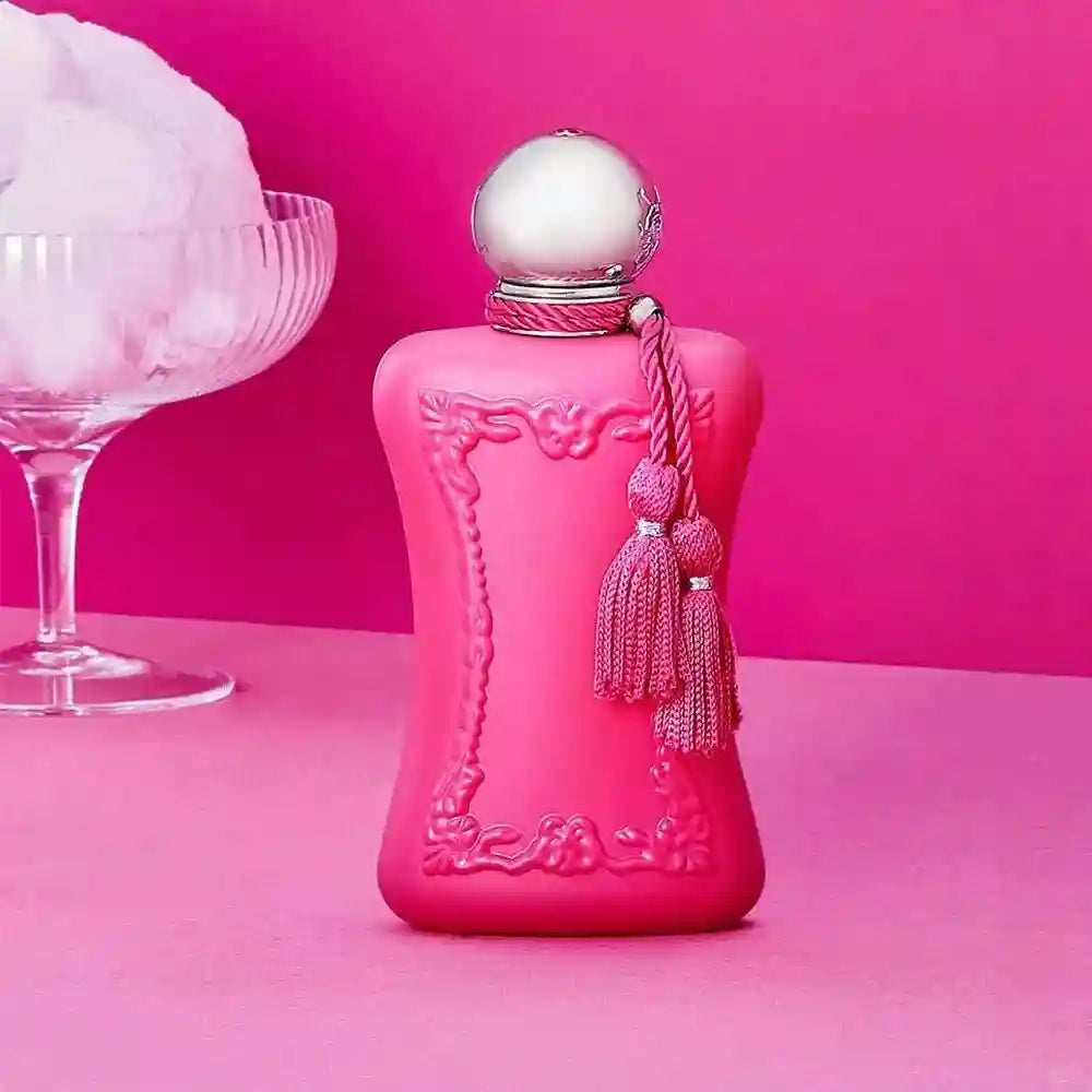 Luxury floral EDP for women: 75ml matte pink designer perfume bottle with silver cap and decorative tassels.