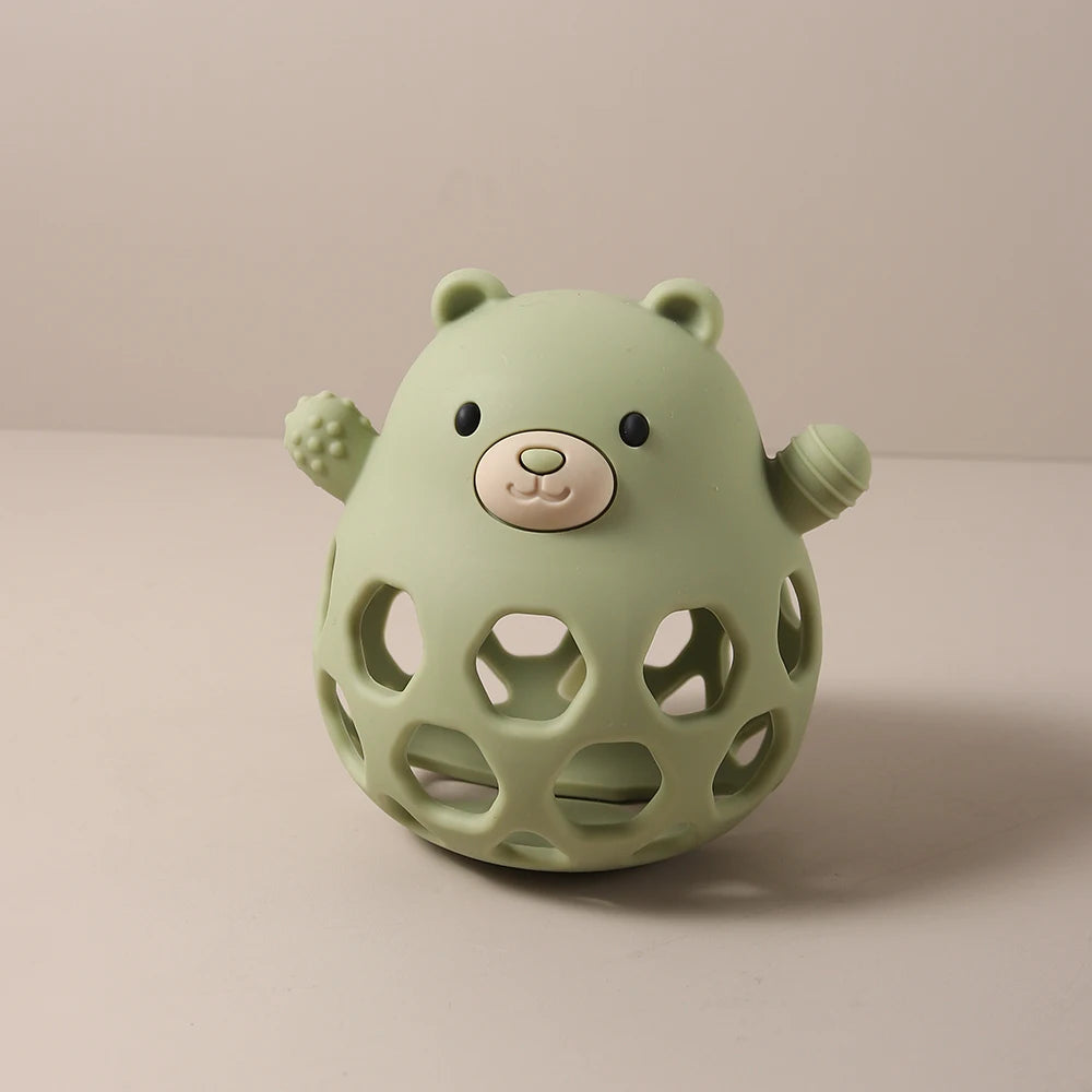 Sage green silicone bear baby teething toy for soothing sore gums.