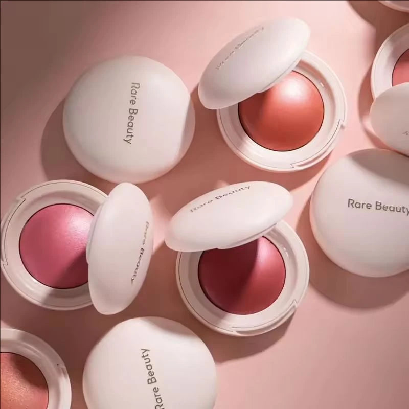 Tidesmit Rare Beauty Liquid Luminizer and Soft Pinch Blusher texture close-up for radiant face makeup application