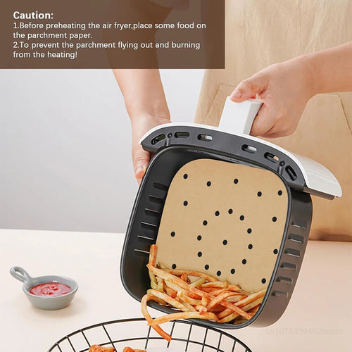 Perforated parchment liner placed in air fryer basket for cooking and steaming