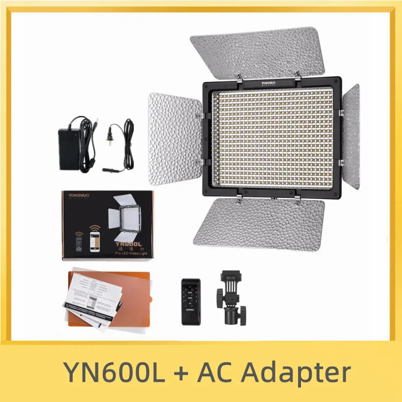 YN600L LED video light panel with silver barndoors, remote control, power adapter, and stand mount.