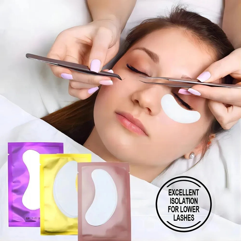 White gel eyelash extension under-eye pads in colorful purple, yellow, and rose gold foil packets for lash isolation.