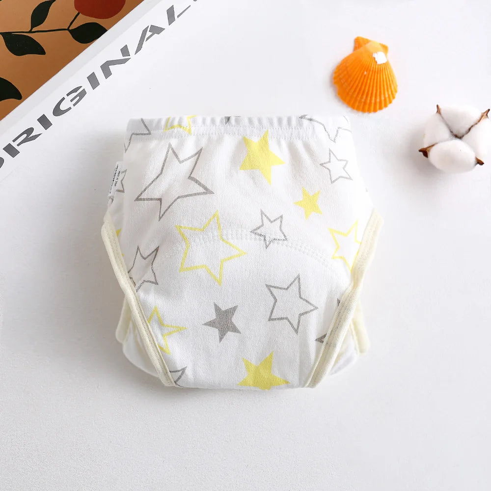 Baby care training diaper with yellow and grey star print, soft cotton fabric for toddlers.