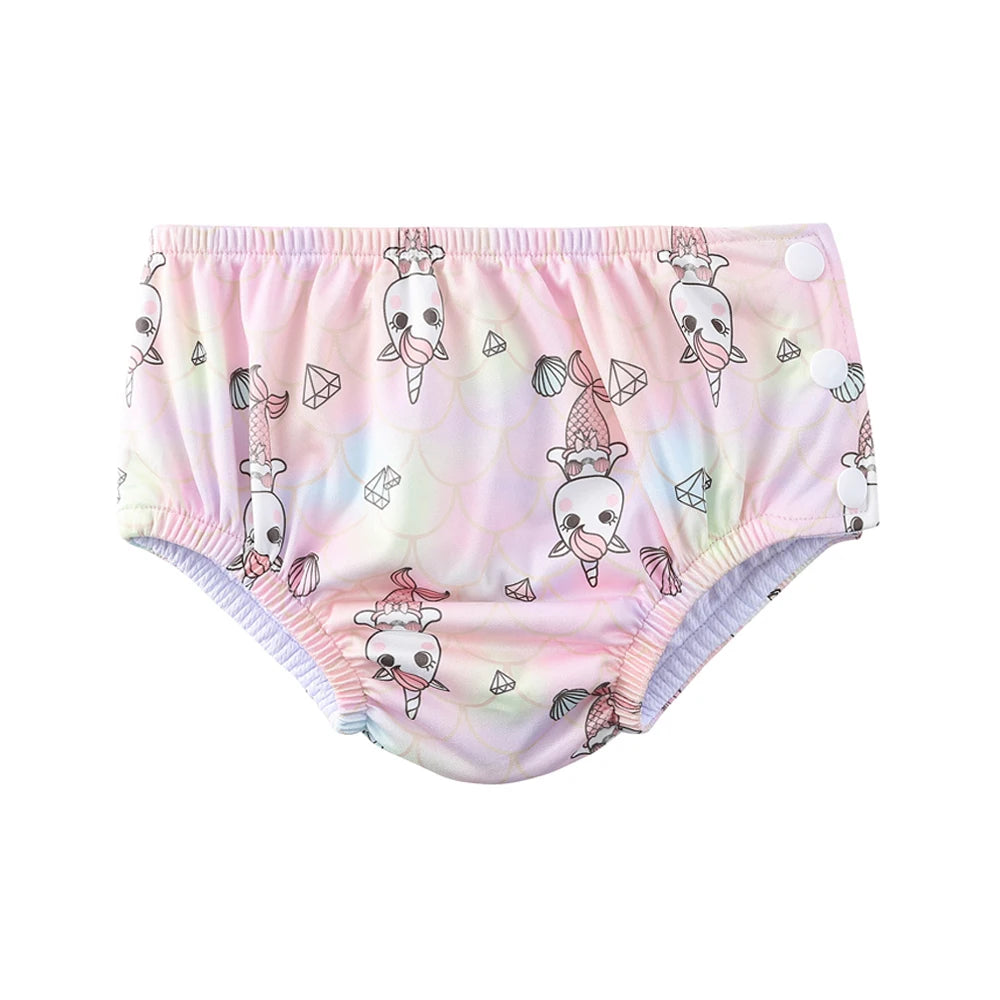 Reusable swim diaper for babies in pink unicorn mermaid print with adjustable side snaps.