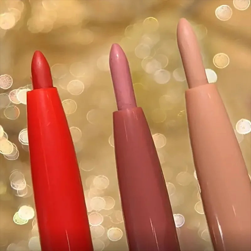 Three dual-ended waterproof matte lip liner pencils in rose red, mauve, and nude shades against a golden bokeh background.