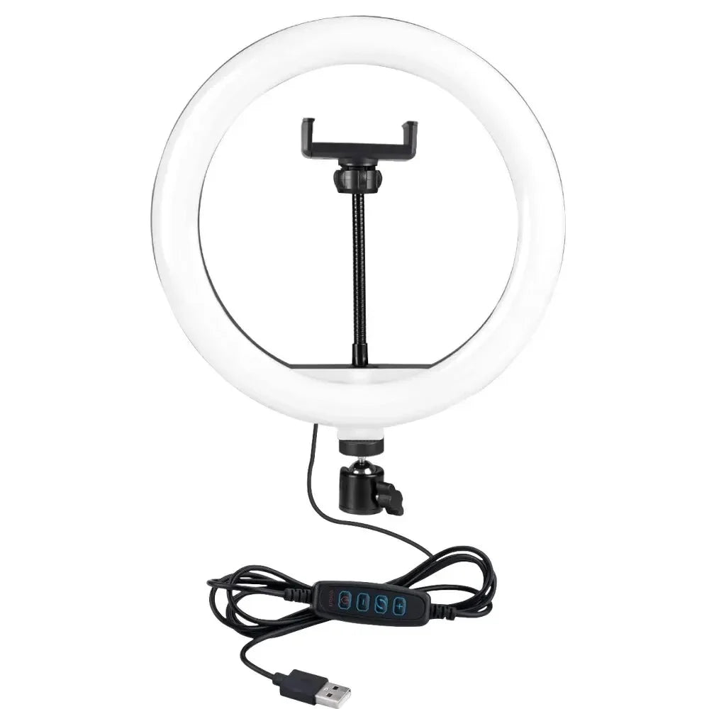 White circular ring light with a center phone mount, adjustable swivel head, and USB power cord with control buttons.