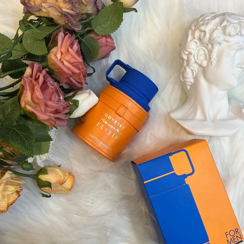 Armaf Odyssey Mandarin Sky Elixir EDP: Woody unisex perfume, orange leather-wrapped bottle with blue cap, gift set.