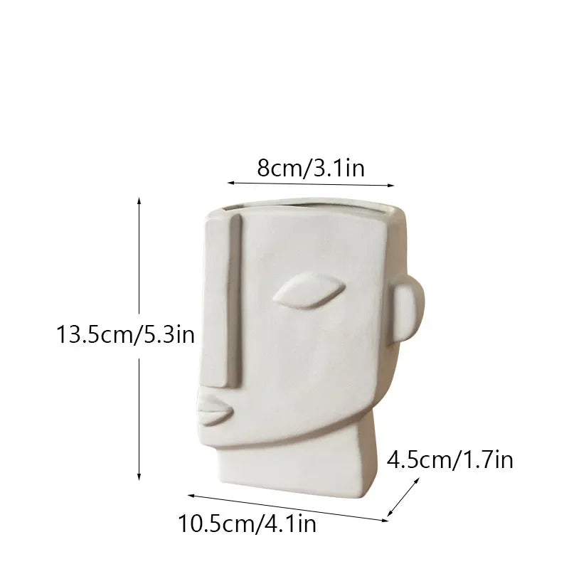 White ceramic face vase with side spout and handle, profile view, 13.5cm height
