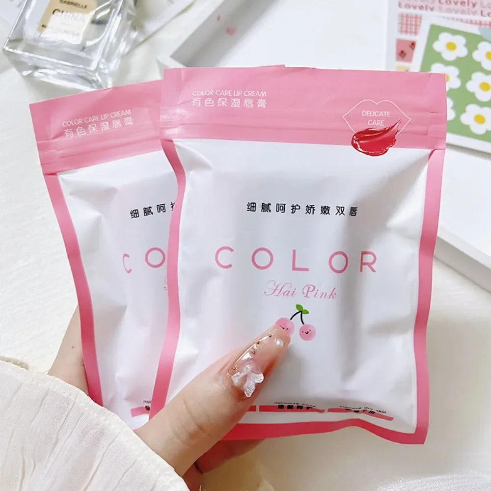 Two pink moisturizing lip balm pouches with cute cherry design, hydrating red lip tint for anti-drying lip care.