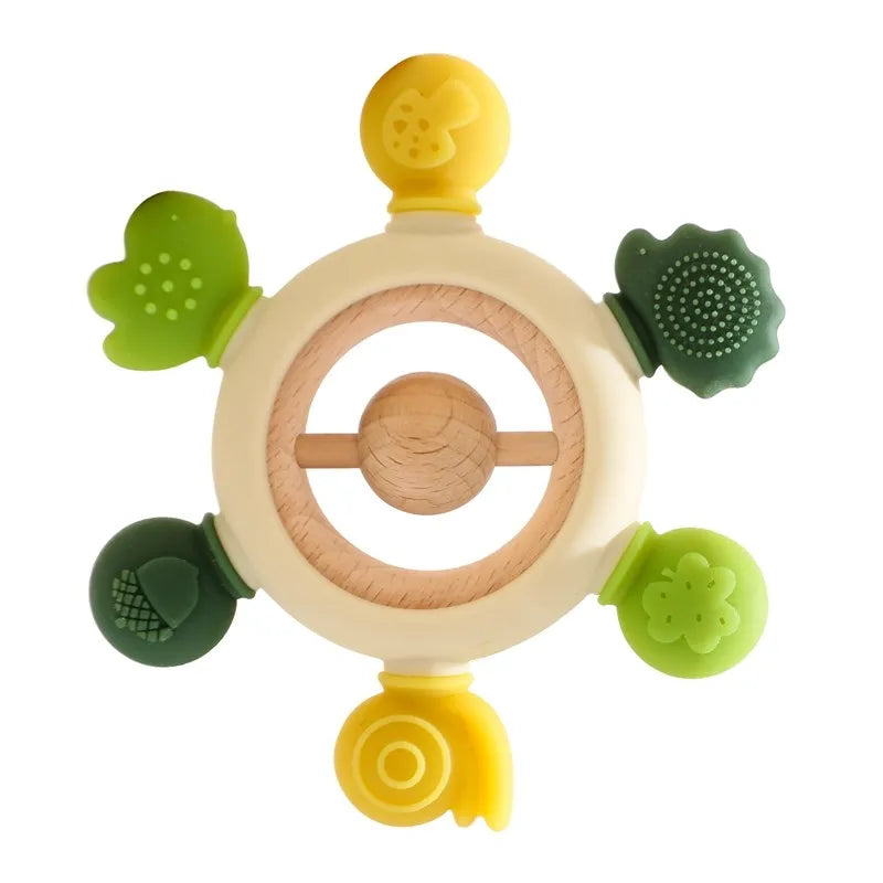 Green and yellow silicone and natural wood baby teething ring toy for infant pain relief.