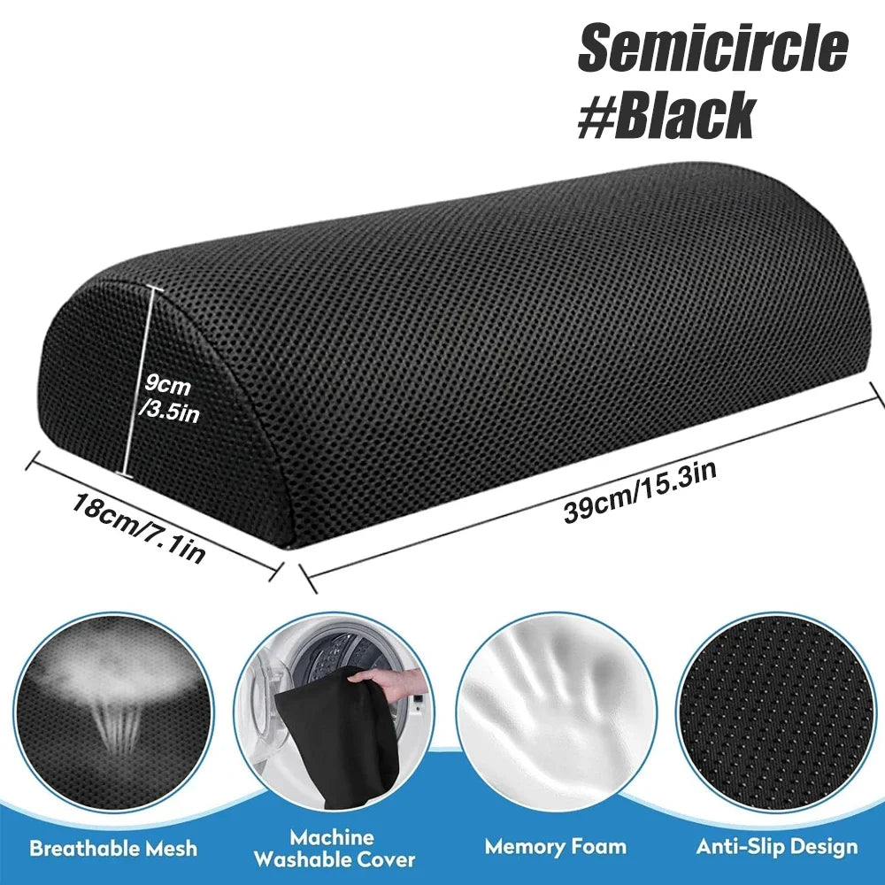 Black semicircular memory foam foot rest with breathable mesh, anti-slip base, and washable cover for under-desk use.