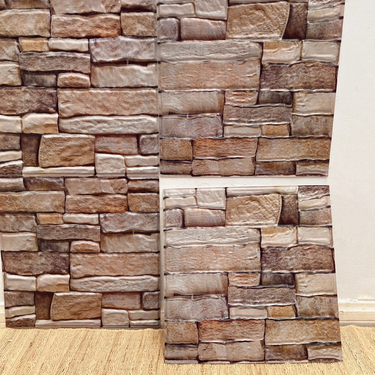 Peel-and-stick brick-style backsplash tiles, raised tan and brown stone pattern