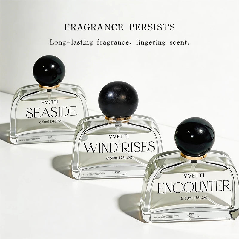 Yvettei luxury women’s perfume set in unique arched glass bottles with black sphere caps. Long-lasting floral fragrance.