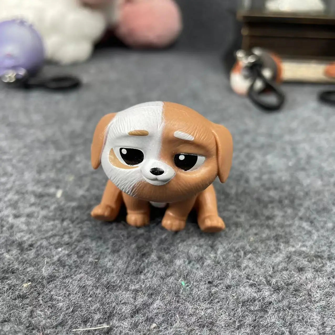 Cute brown and white puppy cartoon figurine, a perfect collectible toy, desk decoration, or gift for pet lovers.