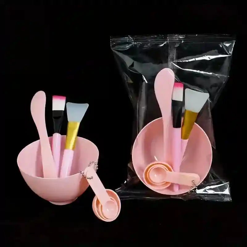 7-piece pink face mask tool kit featuring a mixing bowl, spatulas, brushes, and measuring spoons.
