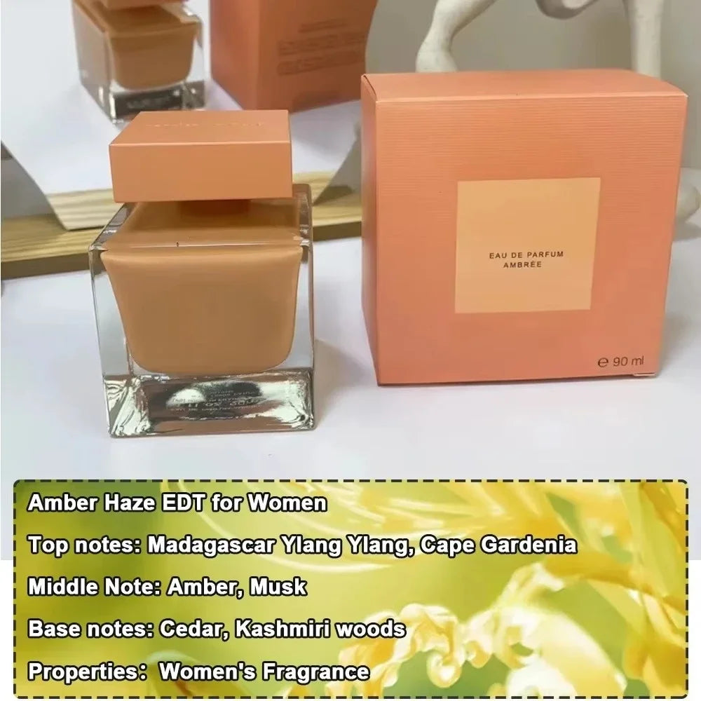 Amber Haze Eau de Parfum for women. Square bottle, woody floral scent with musk, ylang-ylang, and cedar notes. 90ml.