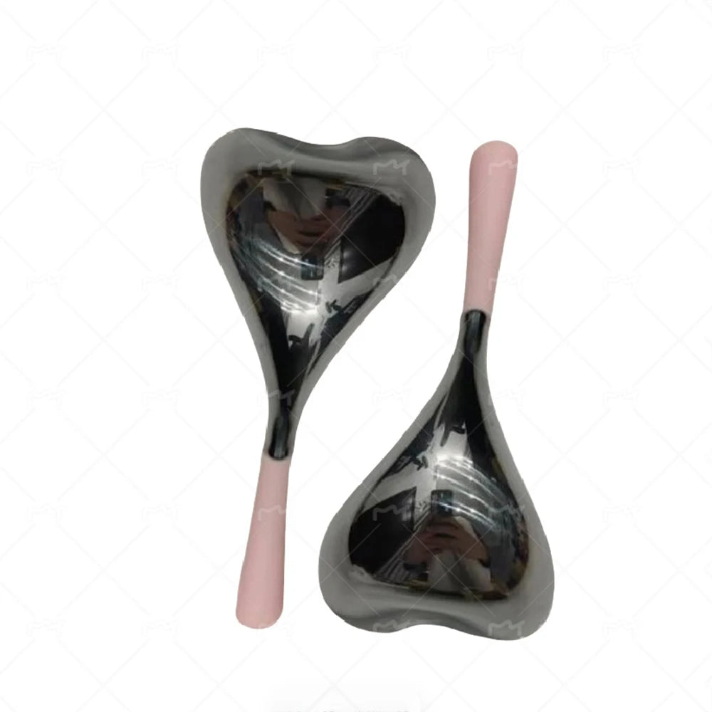 Two heart-shaped, reflective stainless steel cryo massage sticks with smooth, light pink handles.