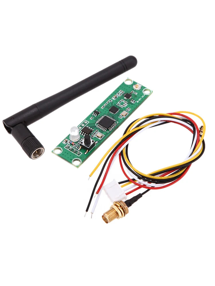Green PCB module with one black antenna, colored wiring harness, and coax pigtail