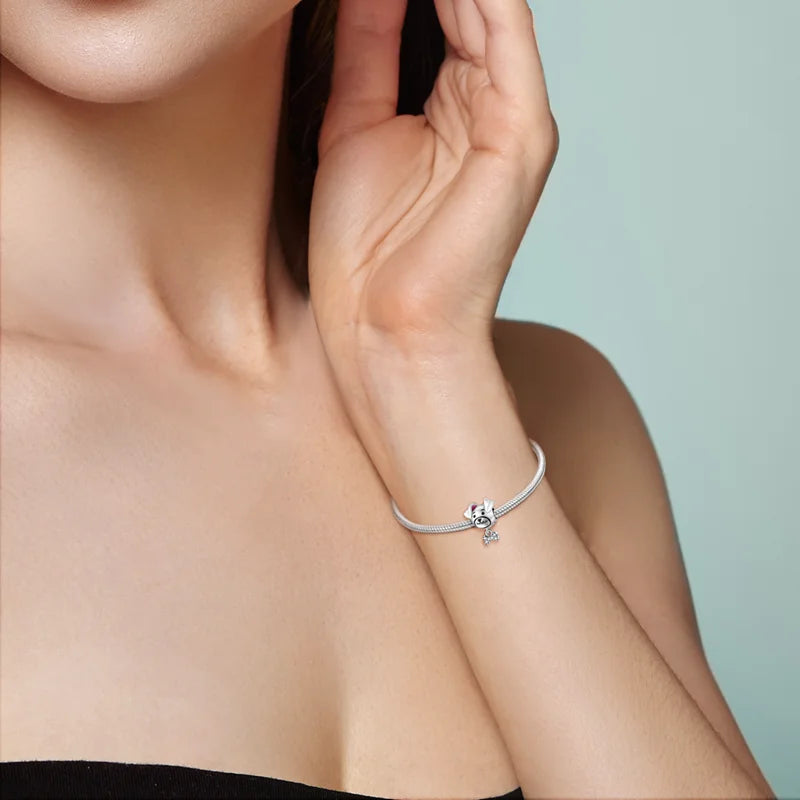 Cute 925 sterling silver puppy dog charm on a bracelet. Perfect jewelry gift for pet lovers and dog moms.