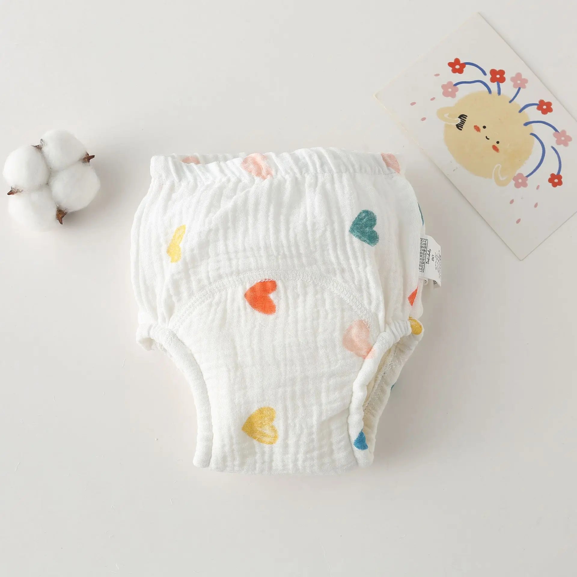Cotton baby training diaper, size 80, with colorful heart pattern for comfortable baby care.