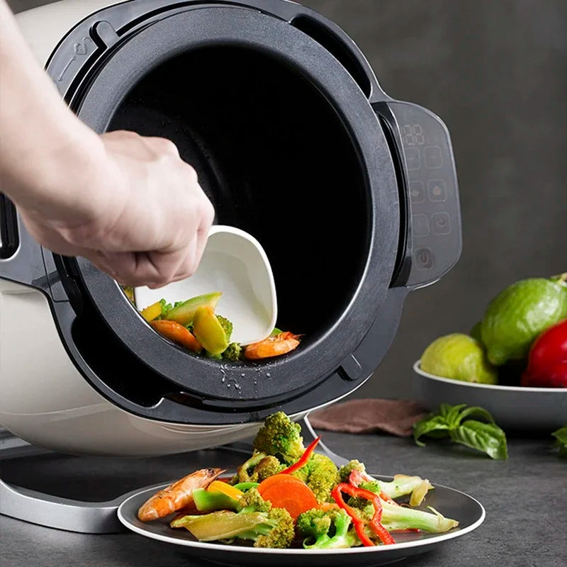Open white multi cooker showing non-stick inner pot with vegetables