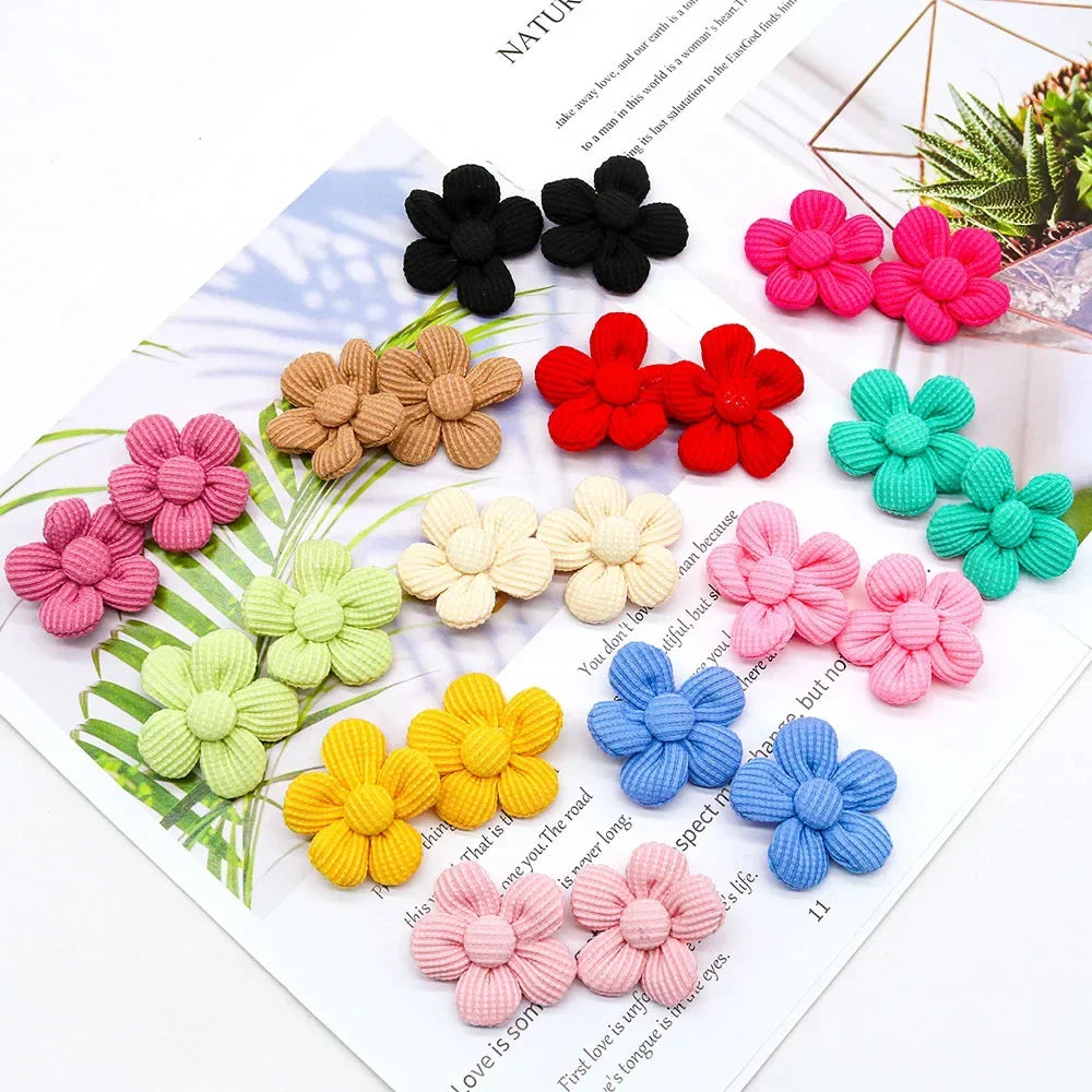 10 colorful flower hair bows for small dogs and cats. Durable rubber band grooming accessories for cute pet styling.