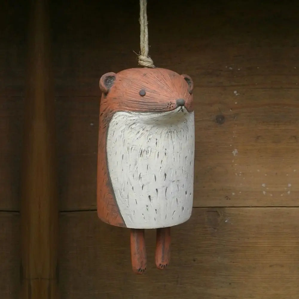 Cute fox resin wind chime for rustic garden decor. Handcrafted animal pendant perfect for outdoor patio hanging.