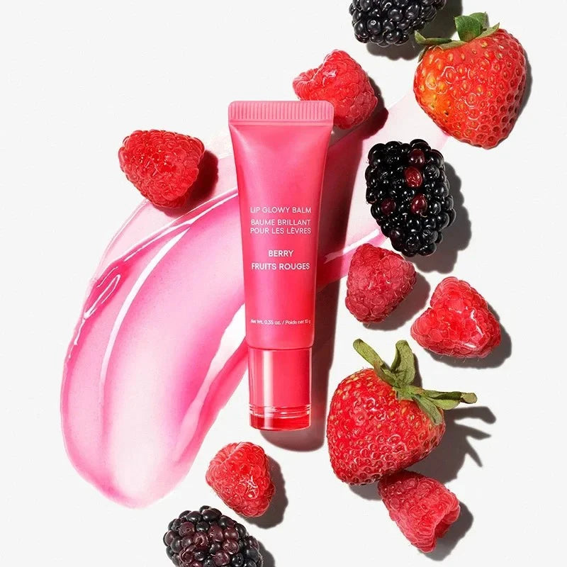 Laneige Berry Lip Glowy Balm tube with pink glossy balm swatch, fresh strawberries, raspberries, and blackberries.