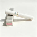 Wonderskin XOXO peel-off tattoo lip stain in white tube with holographic accent and matching product packaging box.