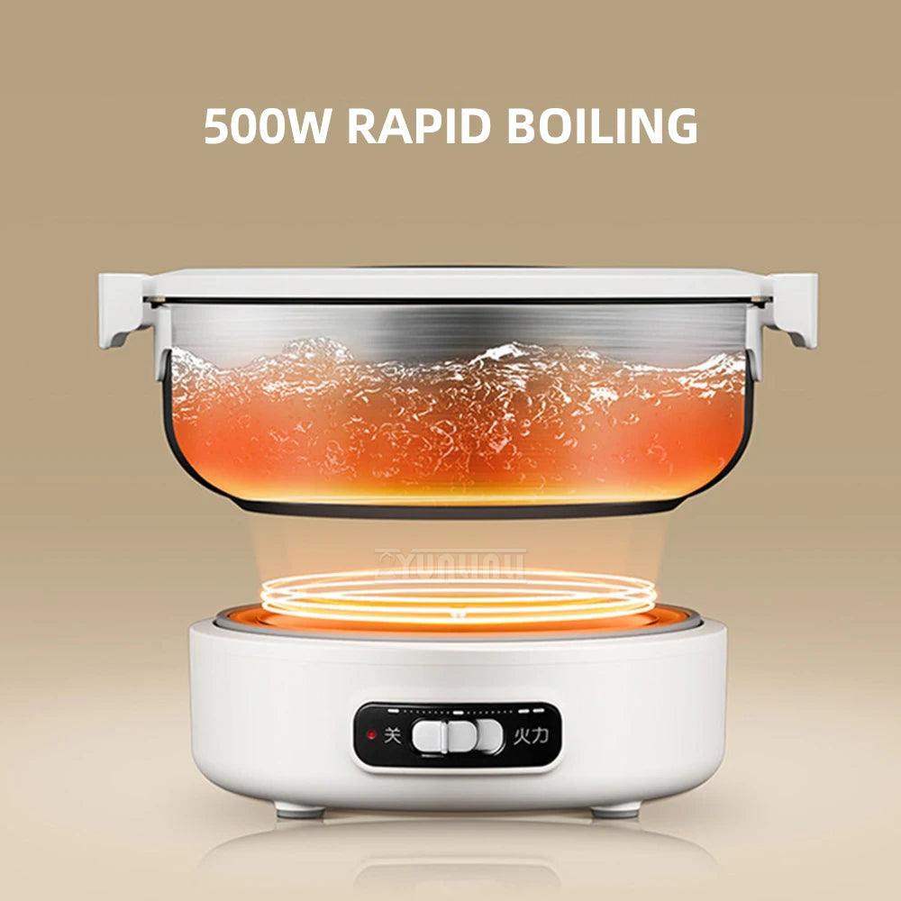 Portable electric cooking pot with clear lid, black bowl, white base, boiling liquid inside